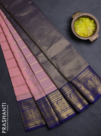 Semi kanchipuram silk saree mild peach pink and navy blue with allover zari stripe pattern and zari woven border