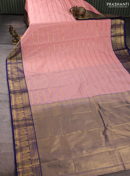 Semi kanchipuram silk saree mild peach pink and navy blue with allover zari stripe pattern and zari woven border