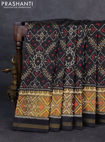 Rajkot patola silk saree black with allover ikat weaves and ikat woven zari border