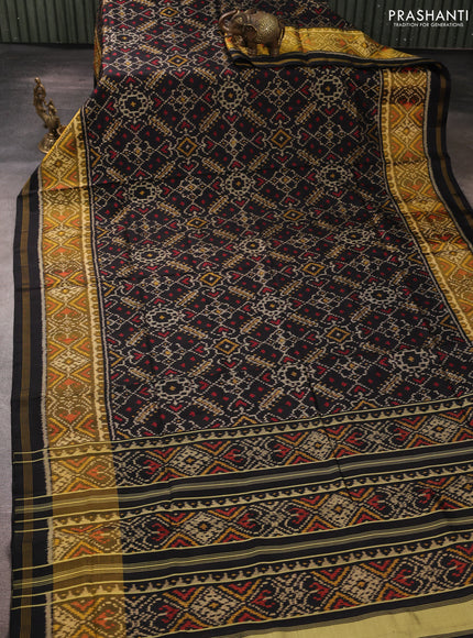 Rajkot patola silk saree black with allover ikat weaves and ikat woven zari border