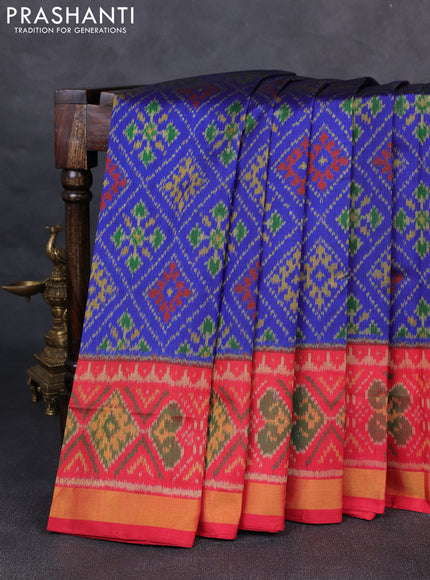 Rajkot patola silk saree blue and kumkum red with allover ikat weaves and ikat woven zari border