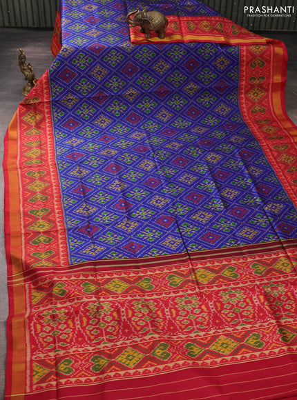 Rajkot patola silk saree blue and kumkum red with allover ikat weaves and ikat woven zari border