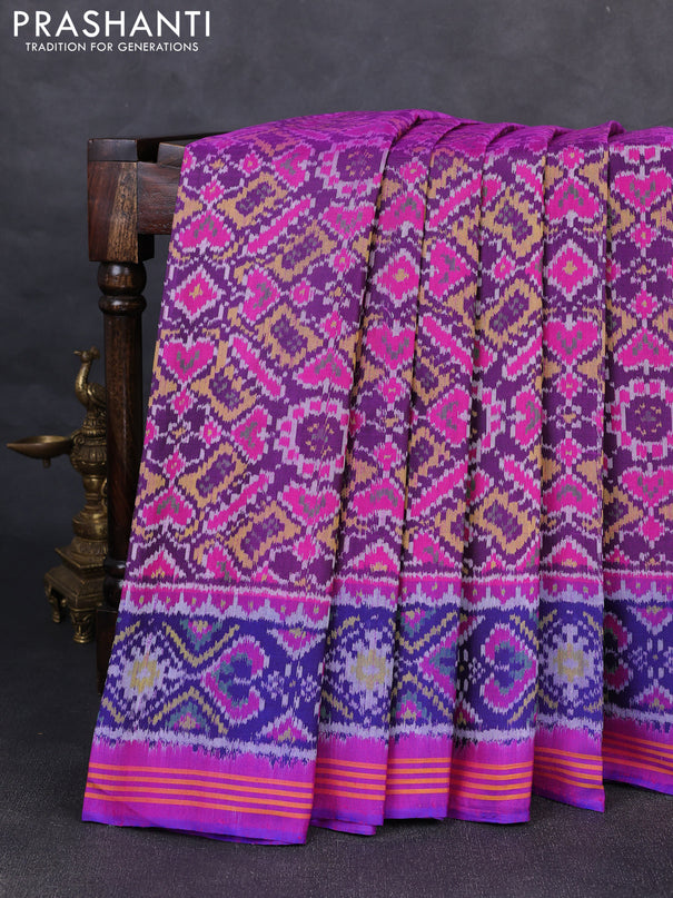 Rajkot patola silk saree dark blue and purple with allover ikat weaves and ikat woven border