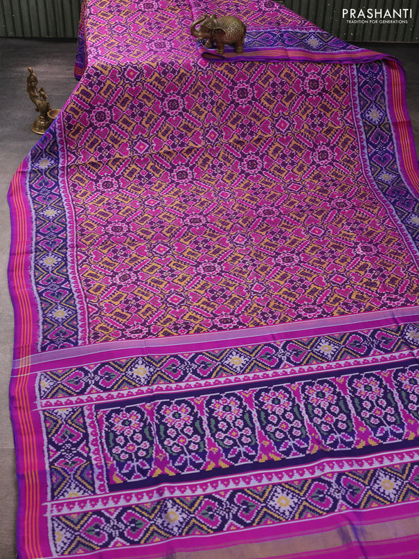 Rajkot patola silk saree dark blue and purple with allover ikat weaves and ikat woven border