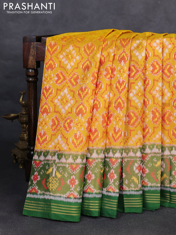 Rajkot patola silk saree mustard yellow and green with allover ikat weaves and ikat woven zari border