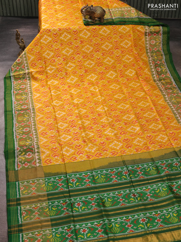 Rajkot patola silk saree mustard yellow and green with allover ikat weaves and ikat woven zari border