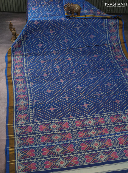Rajkot patola silk saree cs blue with allover ikat weaves and ikat woven zari border