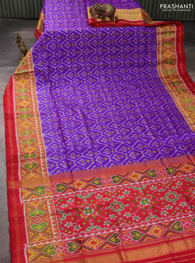 Rajkot patola silk saree purple and kumkum red with allover ikat weaves and ikat woven zari border