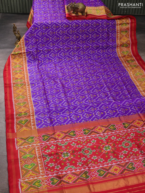 Rajkot patola silk saree purple and kumkum red with allover ikat weaves and ikat woven zari border