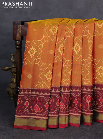 Rajkot patola silk saree dual shade of dark mustard and maroon bottle green with allover ikat weaves & zari buttas and ganga jamuna border