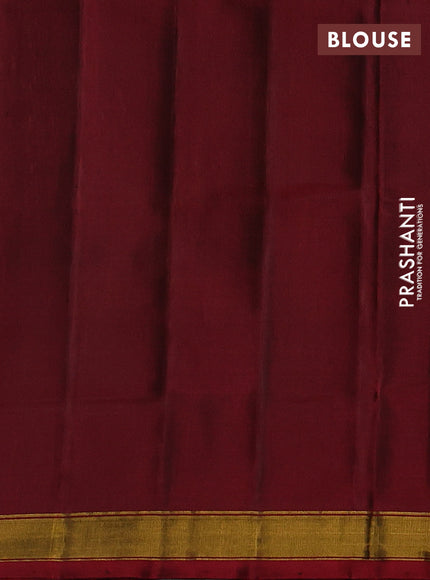 Rajkot patola silk saree dual shade of dark mustard and maroon bottle green with allover ikat weaves & zari buttas and ganga jamuna border
