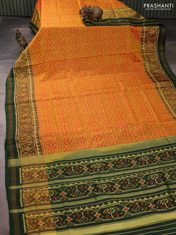 Rajkot patola silk saree dual shade of sunset orange and bottle green with allover ikat weaves and zari woven ikat border