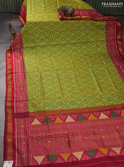 Rajkot patola silk saree green and kumkum red with allover ikat weaves and ikat woven zari border