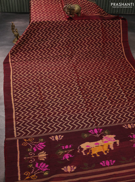 Rajkot patola silk saree maroon with allover zig zag ikat weaves & jute finish and ikat woven simple border