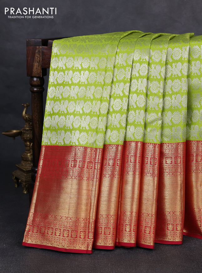 Pure kanchipuram silk saree fluorescent green and maroon with allover silver zari woven brocade weaves and long zari woven border