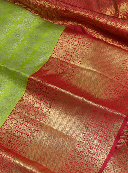 Pure kanchipuram silk saree fluorescent green and maroon with allover silver zari woven brocade weaves and long zari woven border