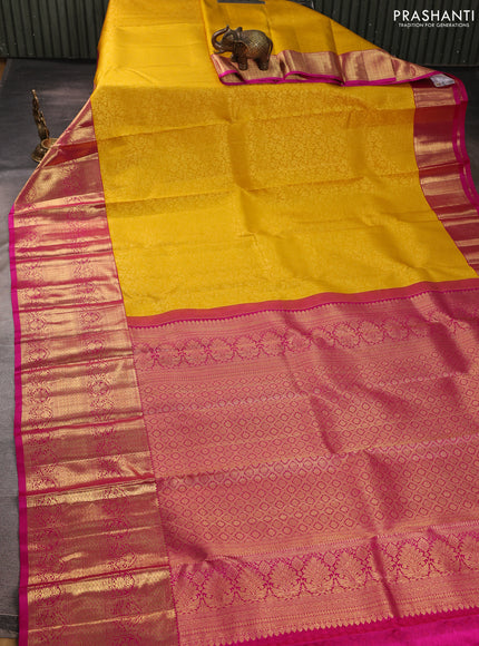 Pure kanchipuram silk saree mango yellow and pink with allover zari woven brocade weaves and long zari woven border
