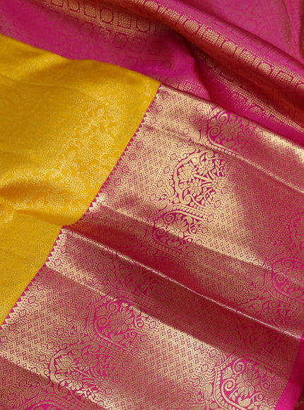 Pure kanchipuram silk saree mango yellow and pink with allover zari woven brocade weaves and long zari woven border