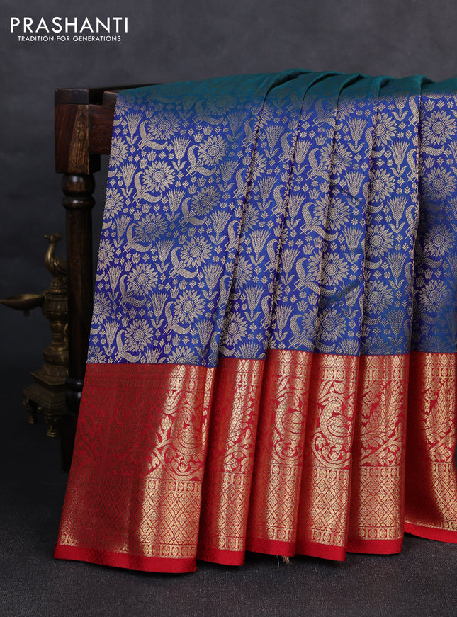 Pure kanchipuram silk saree dual shade of bluish green and red with allover zari woven brocade weaves and long zari woven border