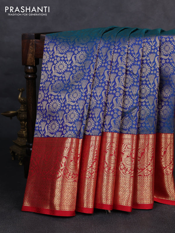 Pure kanchipuram silk saree dual shade of bluish green and red with allover zari woven brocade weaves and long zari woven border