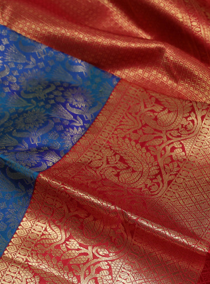 Pure kanchipuram silk saree dual shade of bluish green and red with allover zari woven brocade weaves and long zari woven border