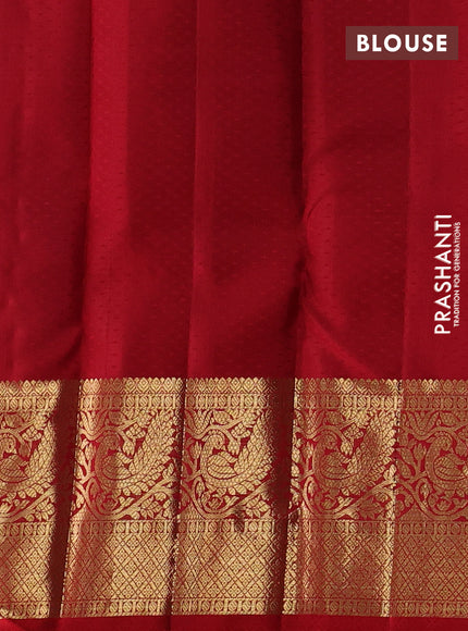 Pure kanchipuram silk saree dual shade of bluish green and red with allover zari woven brocade weaves and long zari woven border