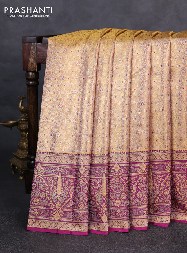 Pure kanchipuram tissue silk saree pastel peach and purple with allover zari woven brocade weaves and rich zari woven minakari border