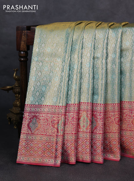 Pure kanchipuram tissue silk saree dual shade of teal green and pink with allover zari woven brocade weaves and rich zari woven minakari border