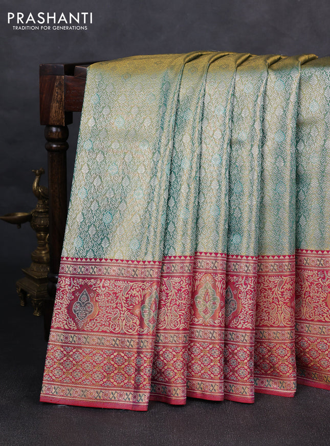 Pure kanchipuram tissue silk saree dual shade of teal green and pink with allover zari woven brocade weaves and rich zari woven minakari border