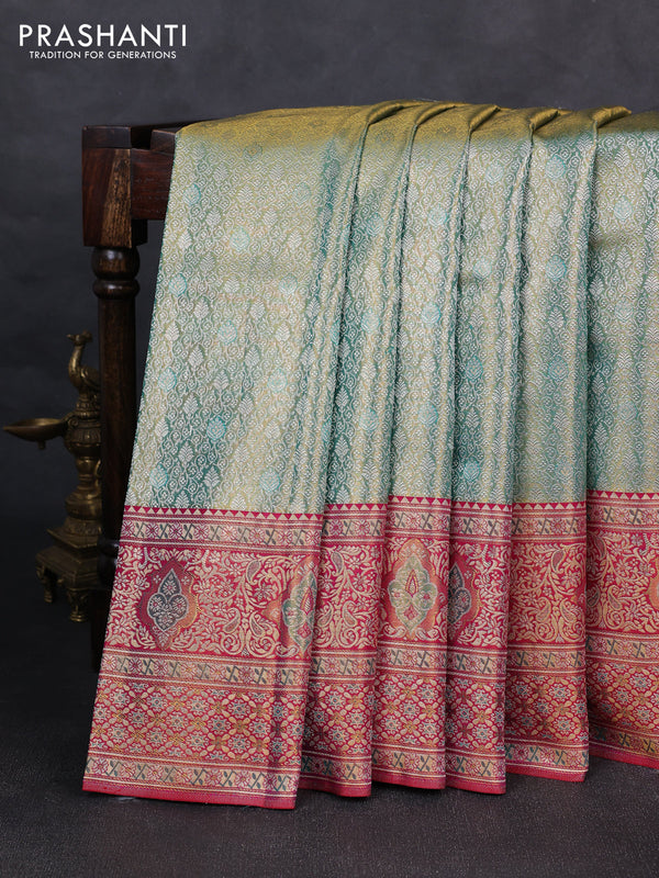 Pure kanchipuram tissue silk saree dual shade of teal green and pink with allover zari woven brocade weaves and rich zari woven minakari border