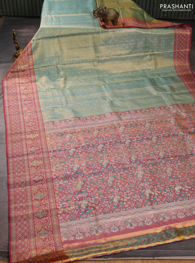 Pure kanchipuram tissue silk saree dual shade of teal green and pink with allover zari woven brocade weaves and rich zari woven minakari border