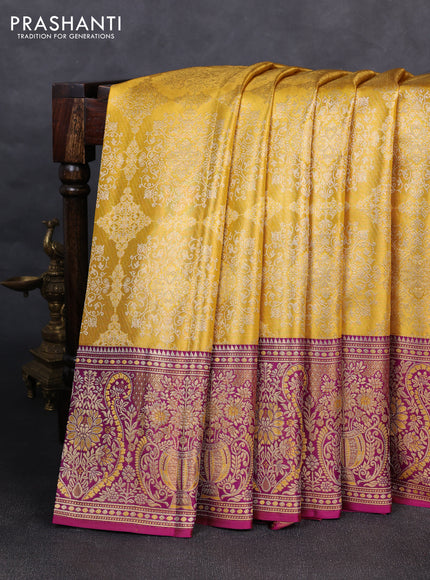 Pure kanchipuram silk saree yellow and purple with allover zari woven brocade weaves and rich zari woven minakari border