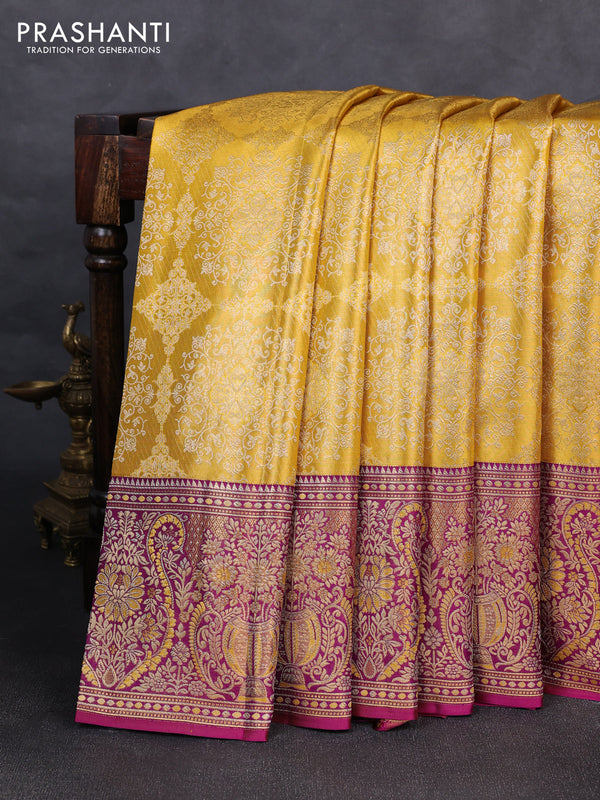 Pure kanchipuram silk saree yellow and purple with allover zari woven brocade weaves and rich zari woven minakari border