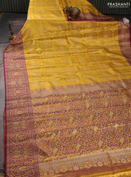 Pure kanchipuram silk saree yellow and purple with allover zari woven brocade weaves and rich zari woven minakari border