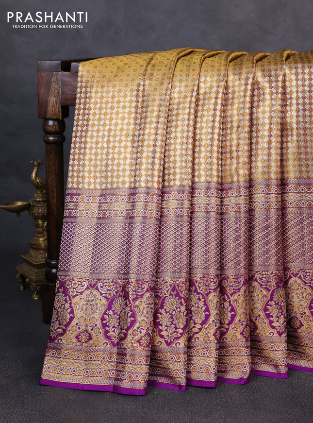 Pure kanchipuram tissue silk saree gold and purple with allover zari woven brocade weaves and long zari woven minakari border