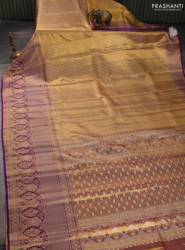 Pure kanchipuram tissue silk saree gold and purple with allover zari woven brocade weaves and long zari woven minakari border