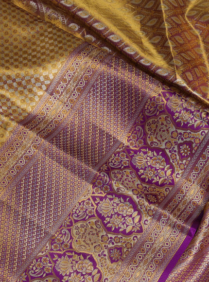 Pure kanchipuram tissue silk saree gold and purple with allover zari woven brocade weaves and long zari woven minakari border