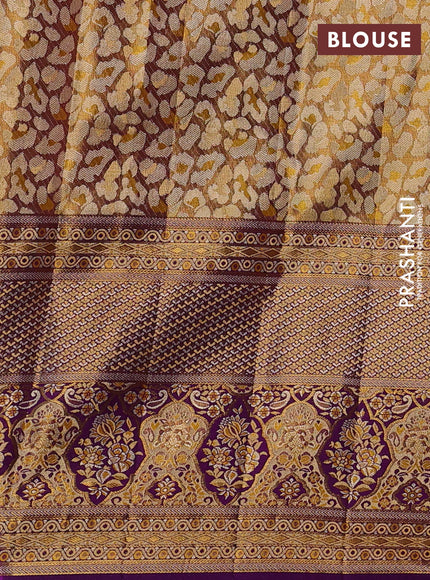 Pure kanchipuram tissue silk saree gold and purple with allover zari woven brocade weaves and long zari woven minakari border