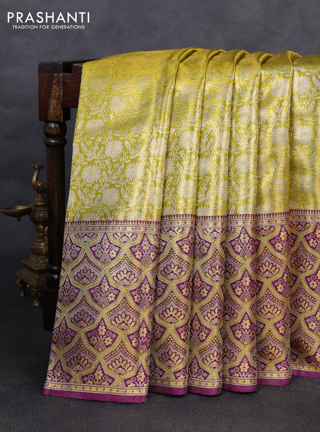 Pure kanchipuram tissue silk saree lime yellow and purple with allover zari woven brocade weaves and long zari woven minakari border