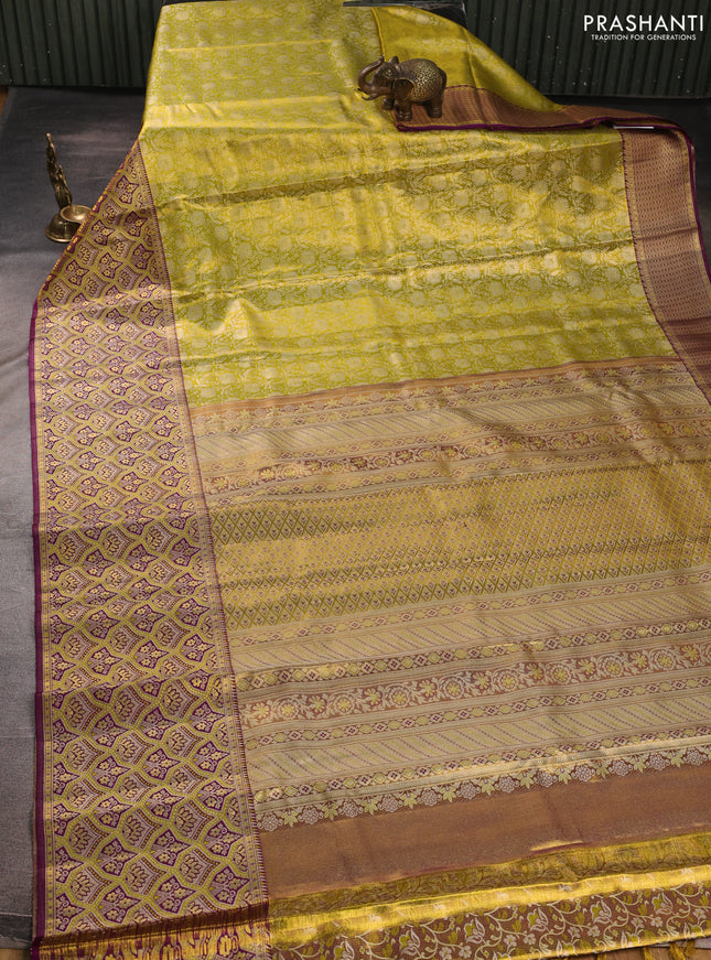 Pure kanchipuram tissue silk saree lime yellow and purple with allover zari woven brocade weaves and long zari woven minakari border