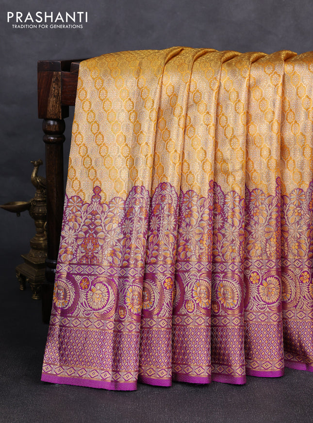 Pure kanchipuram tissue silk saree yellow and purple with allover zari woven brocade weaves and long zari woven minakari border