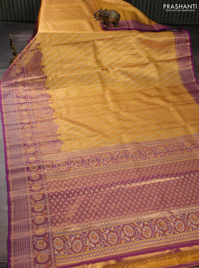 Pure kanchipuram tissue silk saree yellow and purple with allover zari woven brocade weaves and long zari woven minakari border