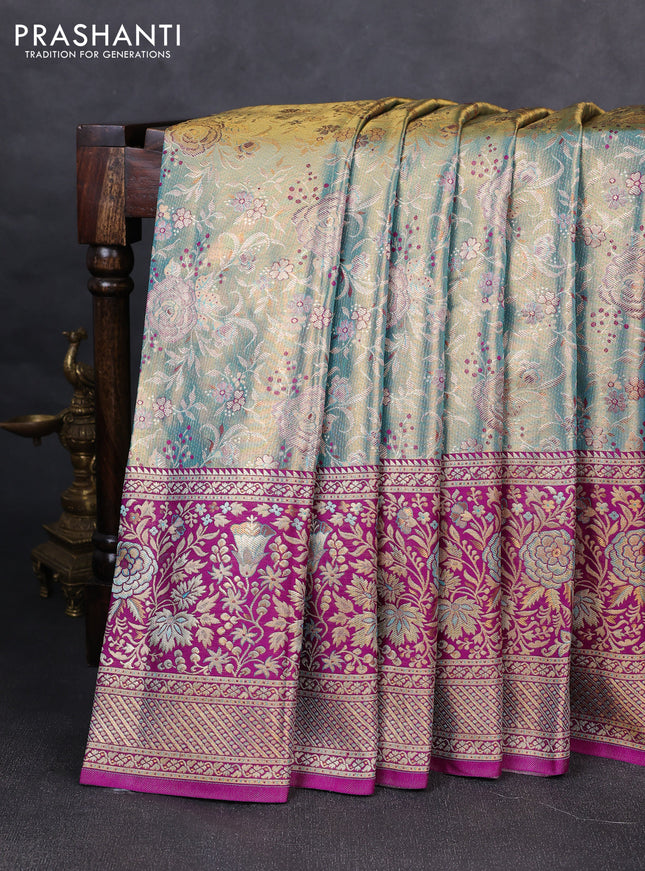Pure kanchipuram tissue silk saree dual shade of teal blue and purple with allover zari woven brocade weaves and long zari woven minakari border