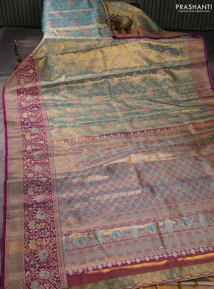 Pure kanchipuram tissue silk saree dual shade of teal blue and purple with allover zari woven brocade weaves and long zari woven minakari border