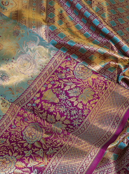 Pure kanchipuram tissue silk saree dual shade of teal blue and purple with allover zari woven brocade weaves and long zari woven minakari border