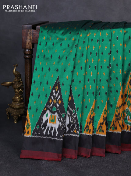 Pochampally silk saree green and black with allover ikat woven buttas and ikat woven simple border