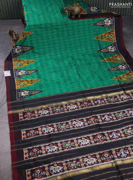 Pochampally silk saree green and black with allover ikat woven buttas and ikat woven simple border