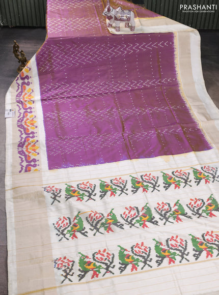 Pochampally silk saree purple shade and cream with allover ikat weaves and ikat zari woven border