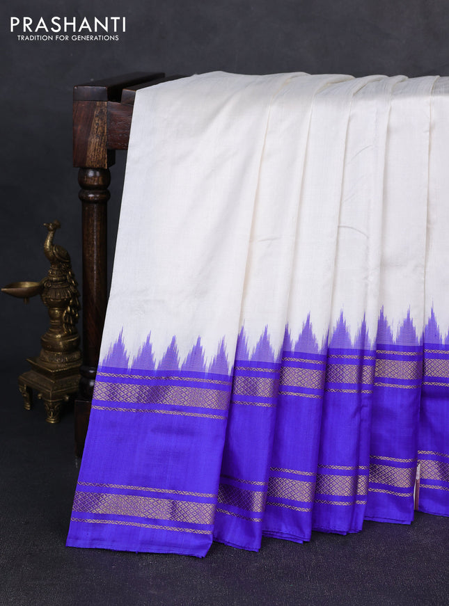 Pochampally silk saree off white and royal blue with plain body and ikat rettapet zari woven border