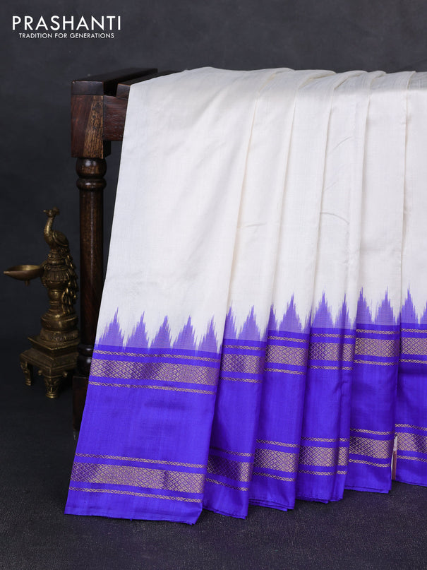 Pochampally silk saree off white and royal blue with plain body and ikat rettapet zari woven border